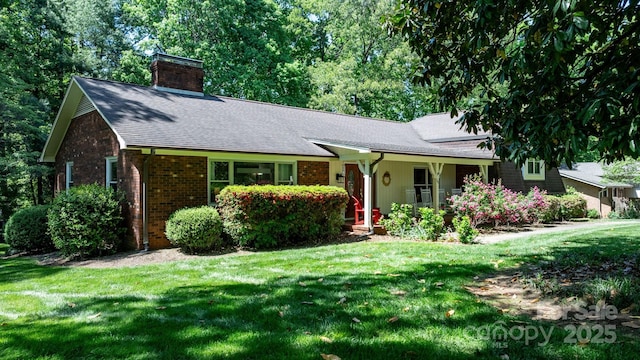 701 5th Ave NE, Conover, NC 28613 - ranch-style home with a chimney, a front yard, brick siding, and roof with shingles