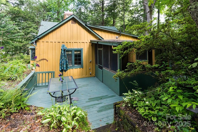 65 Woodfern Dr, Maggie Valley, NC 28751 - wooden deck with a sunroom and view of scattered trees