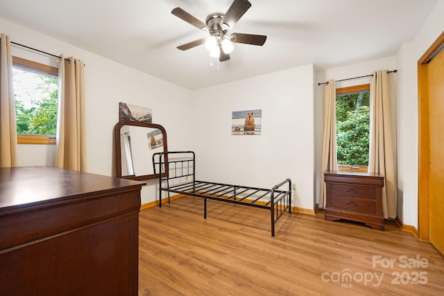 285 Fairway Loop Unit 7, Burnsville, NC 28714 - bedroom with light wood finished floors and multiple windows