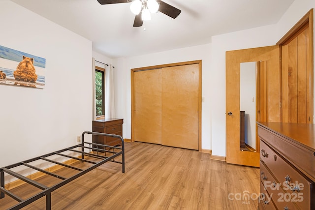 285 Fairway Loop Unit 7, Burnsville, NC 28714 - unfurnished bedroom featuring light wood-type flooring, a closet, and ceiling fan
