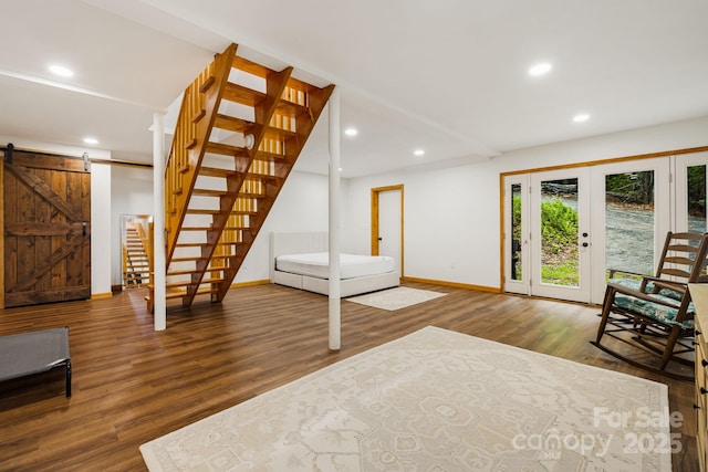 285 Fairway Loop Unit 7, Burnsville, NC 28714 - unfurnished living room with stairs, wood finished floors, a barn door, and recessed lighting
