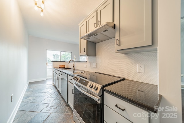 1315 E Blvd Unit 327, Charlotte, NC 28203 - kitchen featuring stainless steel electric range, under cabinet range hood, stone tile floors, and backsplash