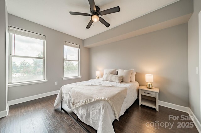 1315 E Blvd Unit 327, Charlotte, NC 28203 - bedroom featuring dark wood finished floors and a ceiling fan