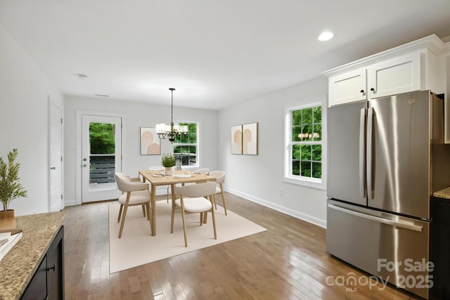 8782 Shepherd Ct, Hildebran, NC 28612 - dining space with wood finished floors, a chandelier, and recessed lighting