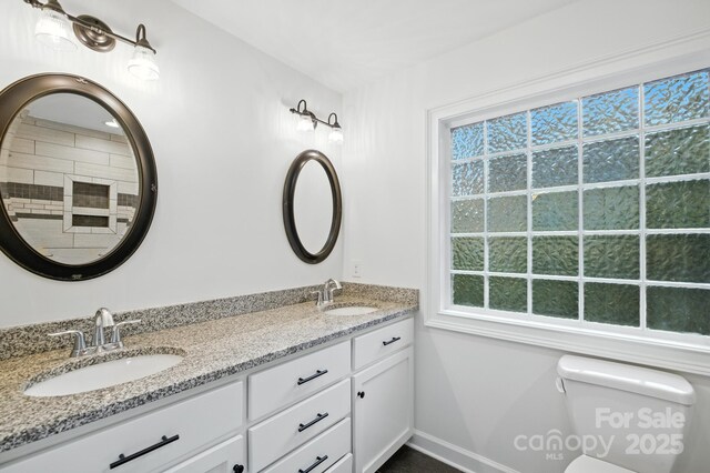 8782 Shepherd Ct, Hildebran, NC 28612 - bathroom with double vanity and baseboards