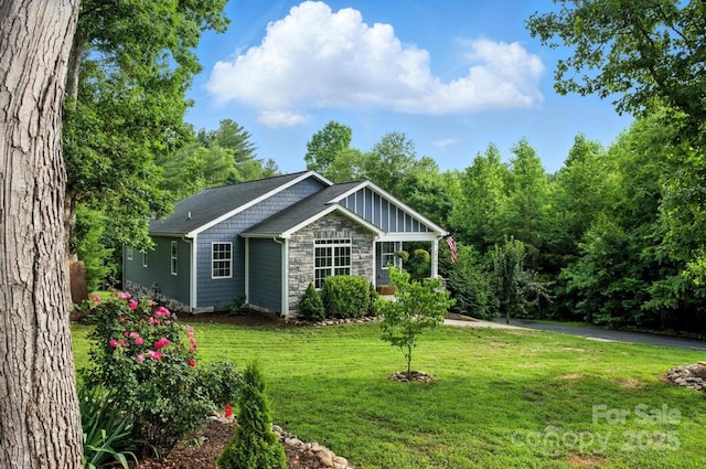 8782 Shepherd Ct, Hildebran, NC 28612 - view of front of property featuring a front yard, board and batten siding, and stone siding