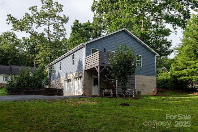 8782 Shepherd Ct, Hildebran, NC 28612 - back of house featuring driveway, an attached garage, and a lawn