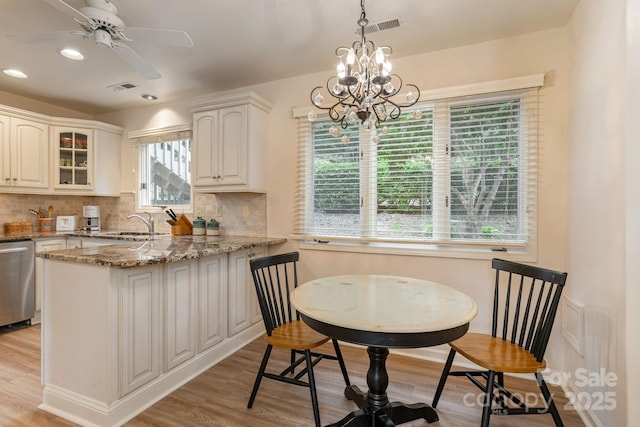 103 Golfside Dr, Flat Rock, NC 28731 - kitchen featuring dishwasher, light wood-style floors, a peninsula, decorative backsplash, and recessed lighting