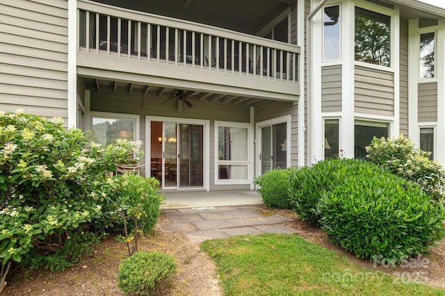 103 Golfside Dr, Flat Rock, NC 28731 - view of exterior entry featuring a balcony and a ceiling fan