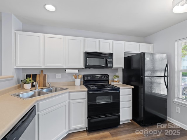 3414 Broadwick St, Charlotte, NC 28213 - kitchen with black appliances, white cabinetry, light countertops, and wood finished floors