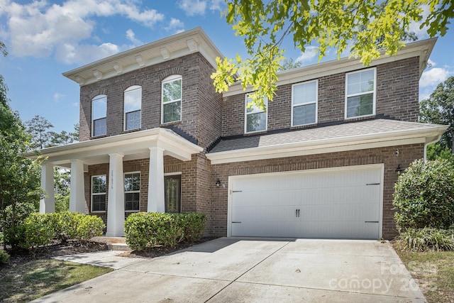 15636 Oleander Dr, Charlotte, NC 28278 - view of front of home with an attached garage, concrete driveway, brick siding, and covered porch