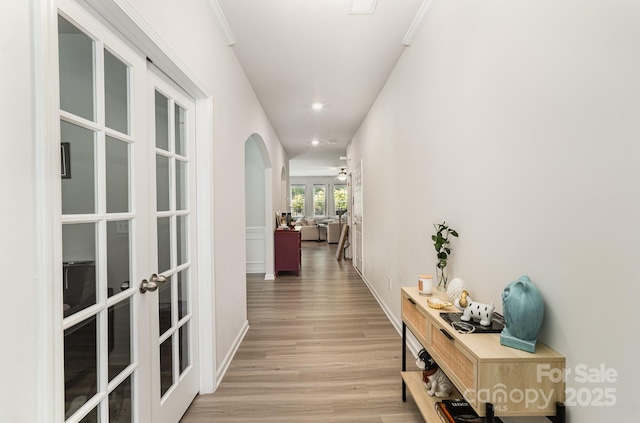 15636 Oleander Dr, Charlotte, NC 28278 - hall featuring french doors, light wood-style flooring, arched walkways, and recessed lighting
