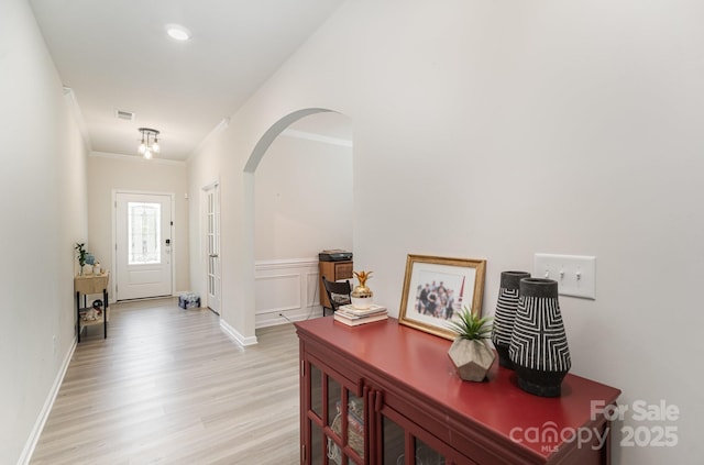 15636 Oleander Dr, Charlotte, NC 28278 - foyer entrance featuring crown molding, light wood-style floors, and arched walkways