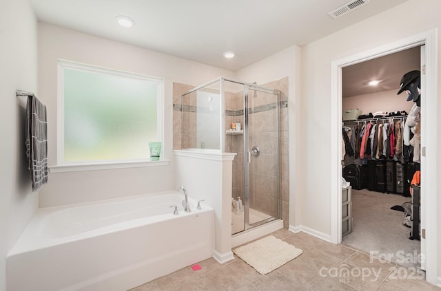 15636 Oleander Dr, Charlotte, NC 28278 - bathroom featuring a bath, a spacious closet, a shower stall, tile patterned flooring, and recessed lighting