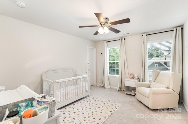 15636 Oleander Dr, Charlotte, NC 28278 - carpeted bedroom with a nursery area and a ceiling fan