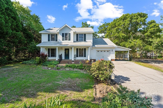 815 La Quinta Ln, Hope Mills, NC 28348 - view of front of home with driveway, covered porch, a front lawn, a carport, and a garage