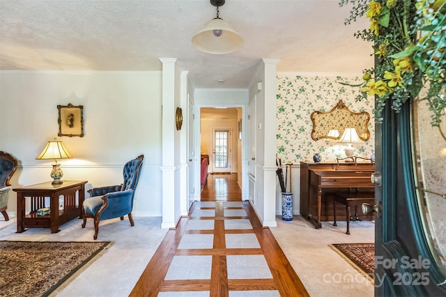 815 La Quinta Ln, Hope Mills, NC 28348 - corridor with decorative columns, crown molding, and a textured ceiling