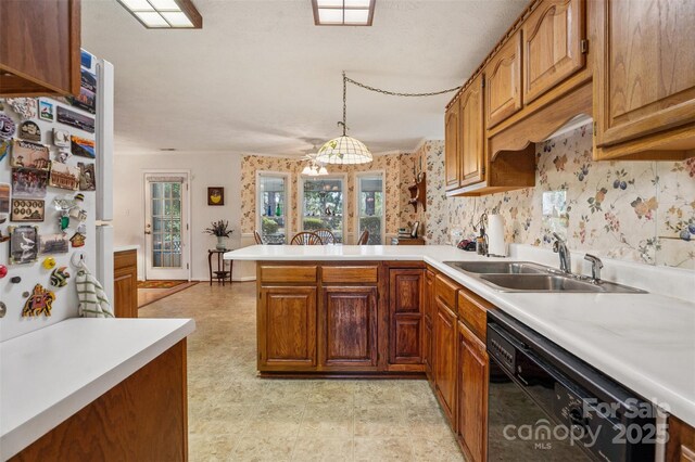 815 La Quinta Ln, Hope Mills, NC 28348 - kitchen with black dishwasher, light countertops, a peninsula, brown cabinets, and pendant lighting