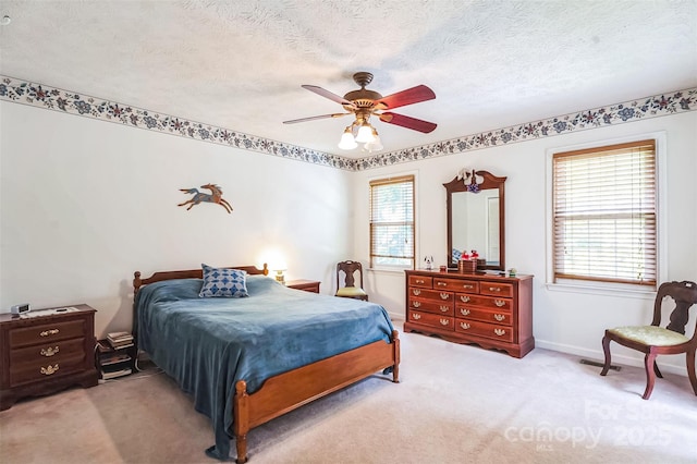 815 La Quinta Ln, Hope Mills, NC 28348 - bedroom with light colored carpet, a ceiling fan, and a textured ceiling