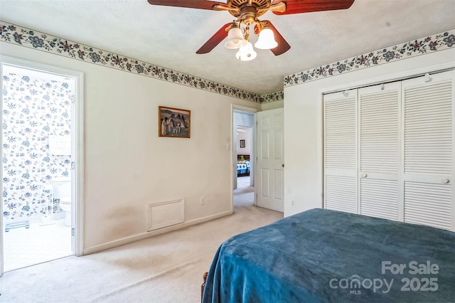 815 La Quinta Ln, Hope Mills, NC 28348 - bedroom featuring carpet floors, a closet, connected bathroom, and a ceiling fan