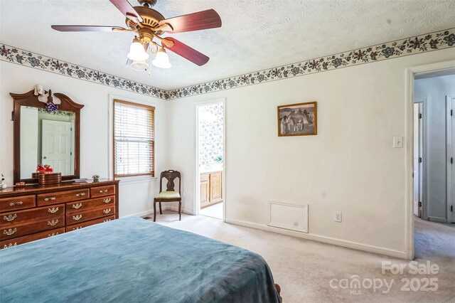 815 La Quinta Ln, Hope Mills, NC 28348 - bedroom with light colored carpet, a textured ceiling, ensuite bathroom, and ceiling fan