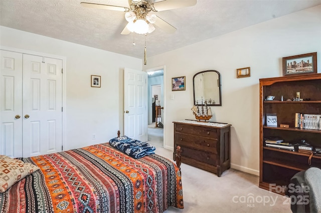 815 La Quinta Ln, Hope Mills, NC 28348 - bedroom with light carpet, a closet, and ceiling fan