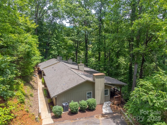 45B Mountain Vw, Villas, Franklin, NC 28734 - view of front of home with a shingled roof, a chimney, and a view of trees