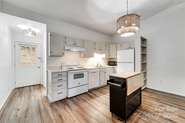 45B Mountain Vw, Villas, Franklin, NC 28734 - kitchen featuring white appliances, under cabinet range hood, light wood-type flooring, and a chandelier