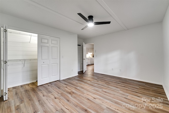 45B Mountain Vw, Villas, Franklin, NC 28734 - unfurnished bedroom featuring wood finished floors, a closet, and a ceiling fan