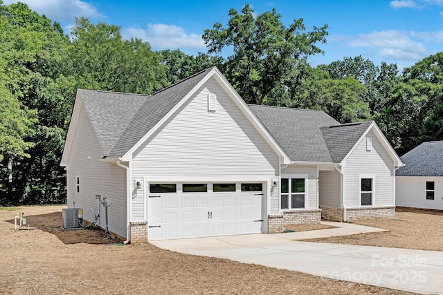 4472 Pebblebrook Cir SW, Concord, NC 28027 - view of front of property with a garage, driveway, roof with shingles, and brick siding
