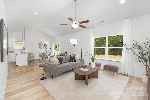 4472 Pebblebrook Cir SW, Concord, NC 28027 - living room featuring light wood-style floors, lofted ceiling, ceiling fan, and recessed lighting