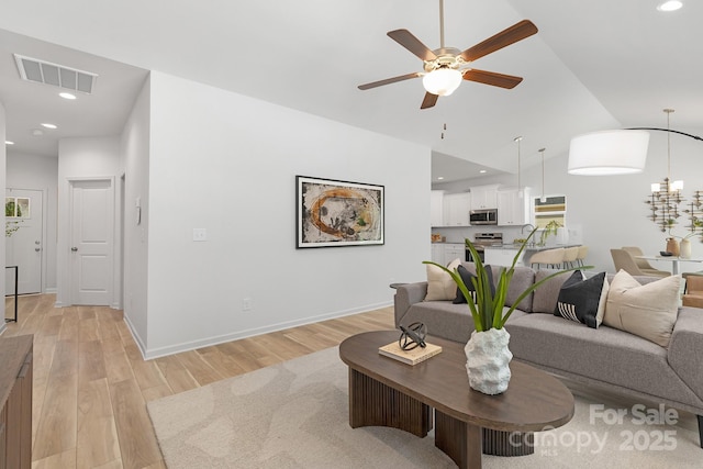 4472 Pebblebrook Cir SW, Concord, NC 28027 - living area featuring light wood-type flooring, a ceiling fan, recessed lighting, and lofted ceiling