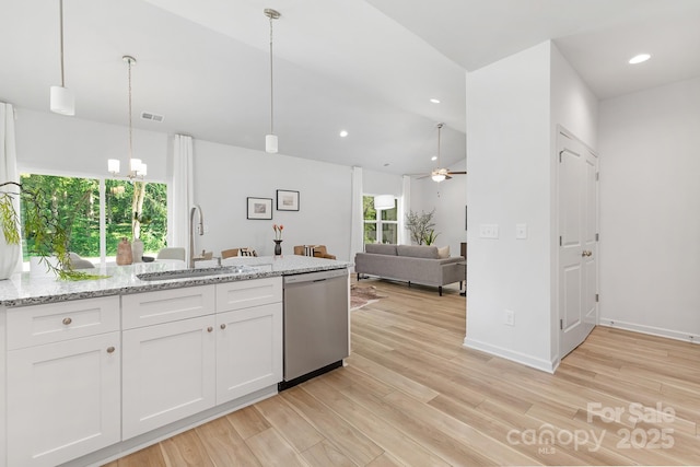 4472 Pebblebrook Cir SW, Concord, NC 28027 - kitchen with dishwasher, white cabinets, light wood-type flooring, light stone counters, and recessed lighting
