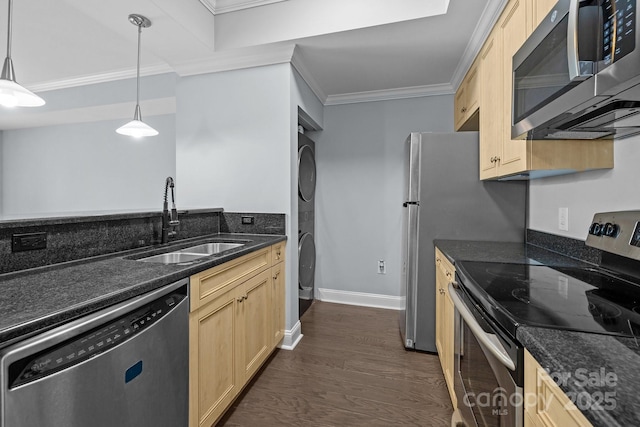 300 W 5th St Unit 617, Charlotte, NC 28202 - kitchen featuring stainless steel appliances, estacked washer and dryer, light brown cabinets, ornamental molding, and dark wood-style floors