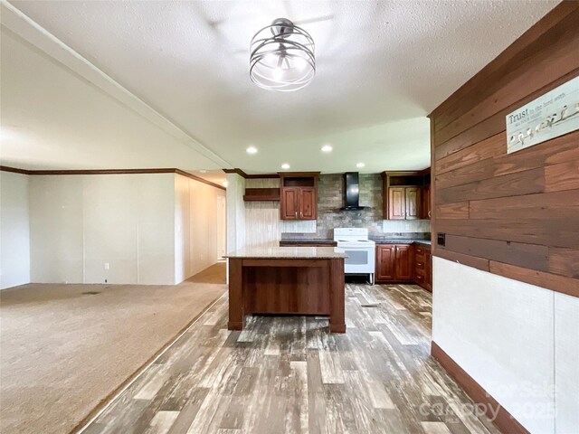 5321 State Line Rd, Marshville, NC 28103 - kitchen with electric range, wall chimney exhaust hood, decorative backsplash, light wood finished floors, and ornamental molding
