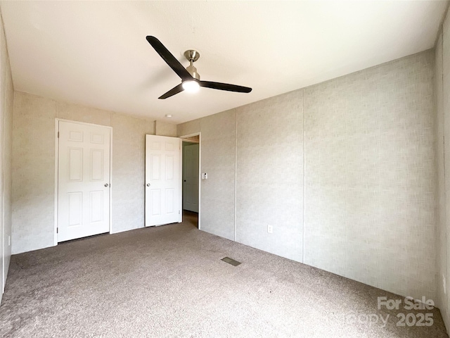 5321 State Line Rd, Marshville, NC 28103 - unfurnished bedroom featuring carpet, ceiling fan, and a closet