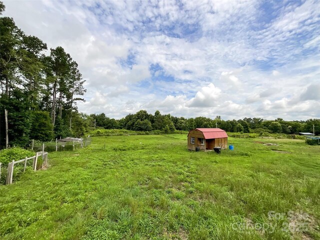 5321 State Line Rd, Marshville, NC 28103 - view of yard featuring a storage unit and a view of countryside