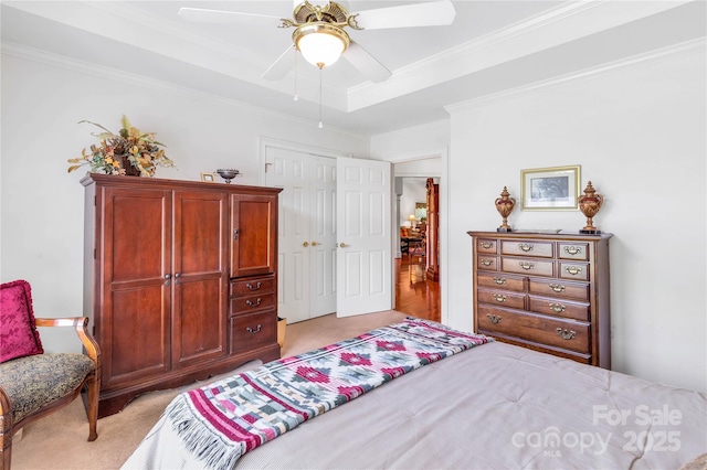 511 Birmingham Ct, Rock Hill, SC 29732 - bedroom featuring light carpet, crown molding, a ceiling fan, a closet, and a tray ceiling