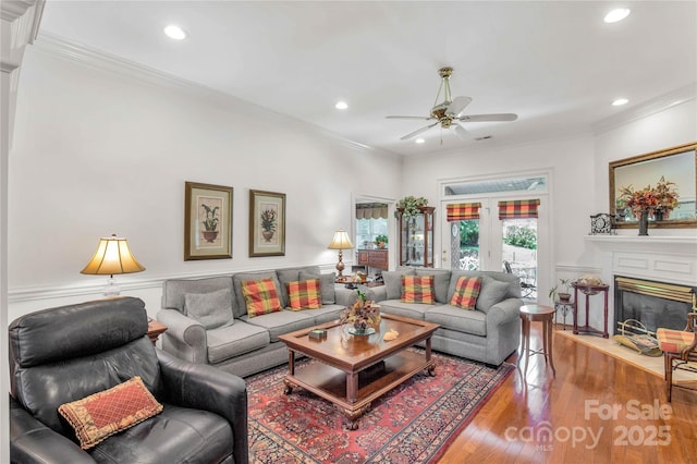 511 Birmingham Ct, Rock Hill, SC 29732 - living room featuring crown molding, recessed lighting, a ceiling fan, wood finished floors, and a glass covered fireplace