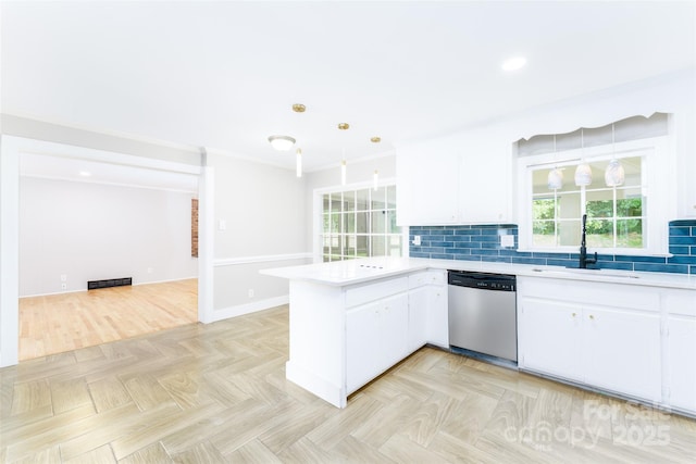 1728 Colony Rd, Salisbury, NC 28144 - kitchen with dishwasher, a peninsula, light countertops, white cabinets, and backsplash