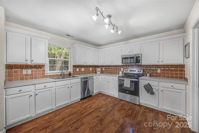 241 Chestnut Ave, Tega Cay, SC 29708 - kitchen with appliances with stainless steel finishes, white cabinetry, light countertops, and a textured ceiling