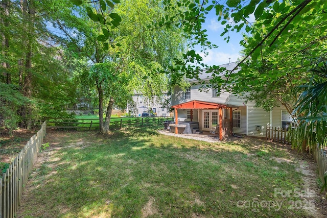 241 Chestnut Ave, Tega Cay, SC 29708 - fenced backyard with french doors, a hot tub, and a patio