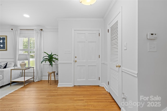 1024 Regency Dr, Charlotte, NC 28211 - entryway featuring light wood finished floors, crown molding, and recessed lighting