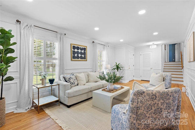 1024 Regency Dr, Charlotte, NC 28211 - living area with a decorative wall, light wood-type flooring, stairs, ornamental molding, and recessed lighting