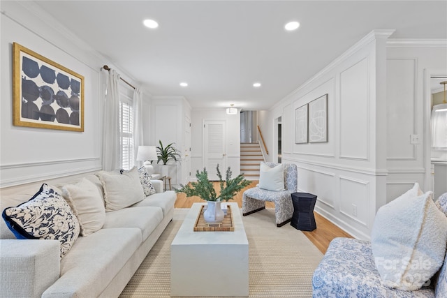 1024 Regency Dr, Charlotte, NC 28211 - living room with a decorative wall, light wood-type flooring, stairs, recessed lighting, and ornamental molding