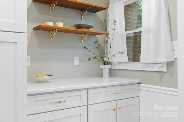 1024 Regency Dr, Charlotte, NC 28211 - kitchen with white cabinets, light countertops, and open shelves