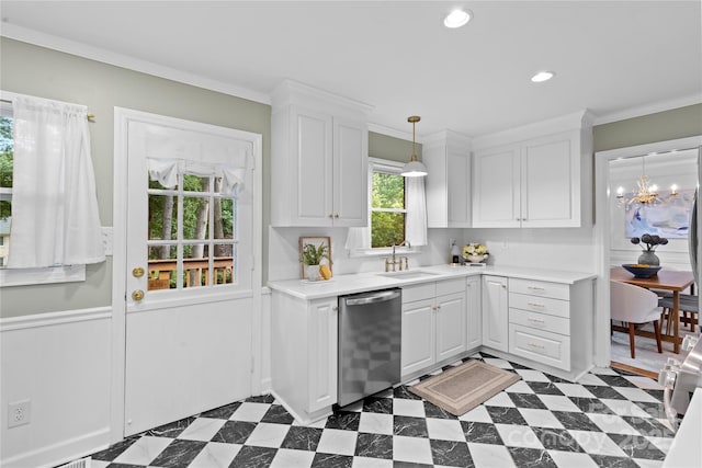 1024 Regency Dr, Charlotte, NC 28211 - kitchen with stainless steel dishwasher, white cabinetry, light countertops, ornamental molding, and wainscoting