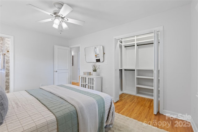 1024 Regency Dr, Charlotte, NC 28211 - bedroom featuring light wood-style floors, a ceiling fan, and a closet
