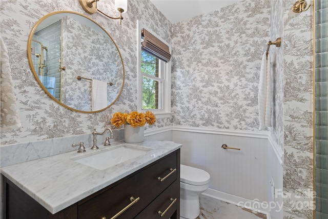 1024 Regency Dr, Charlotte, NC 28211 - bathroom with vanity, wainscoting, wallpapered walls, and a shower