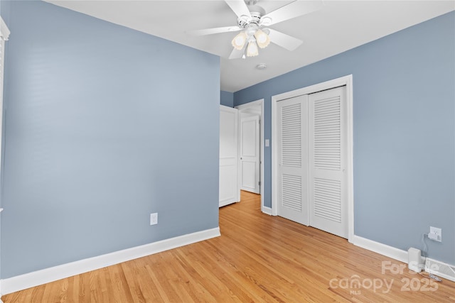 1024 Regency Dr, Charlotte, NC 28211 - unfurnished bedroom with a closet, light wood finished floors, and a ceiling fan